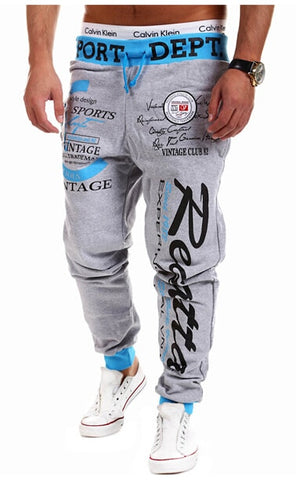 New 2019 Casual Joggers Letter Printed Pants Men Cotton Elastic Long Trousers Low Waist Lace Up Cargo Pencil Pants Men Leggings